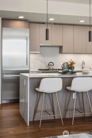 a kitchen with a sink cabinets and stainless steel appliances