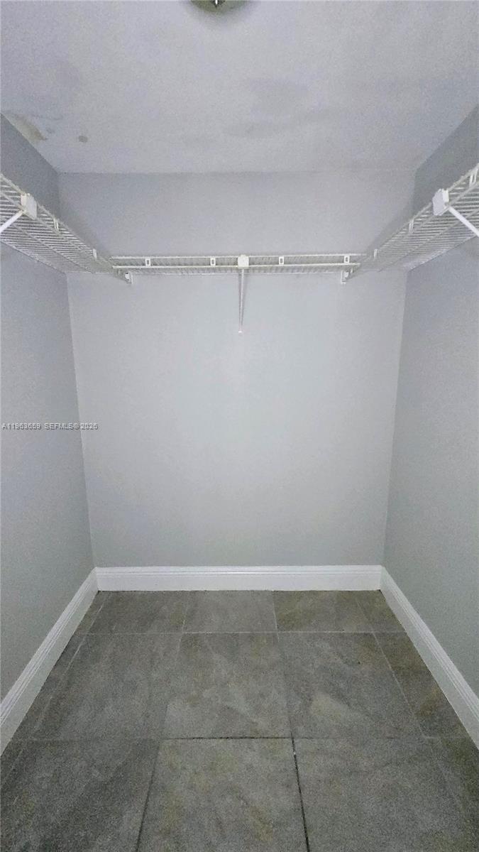 7925 Fairview Drive, Unit 206 Tamarac, FL 33321 - Photo 11 of 21 a view of a room with shelf on the wall