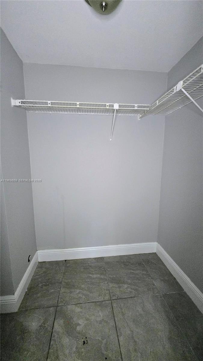 7925 Fairview Drive, Unit 206 Tamarac, FL 33321 - Photo 13 of 21 a view of a room with racks on the wall