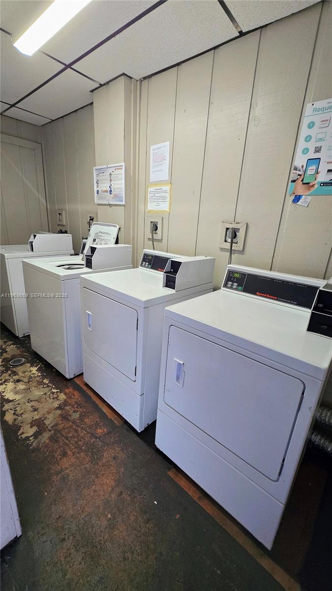 7925 Fairview Drive, Unit 206 Tamarac, FL 33321 - Photo 18 of 21 a bathroom with a double vanity sink and mirror