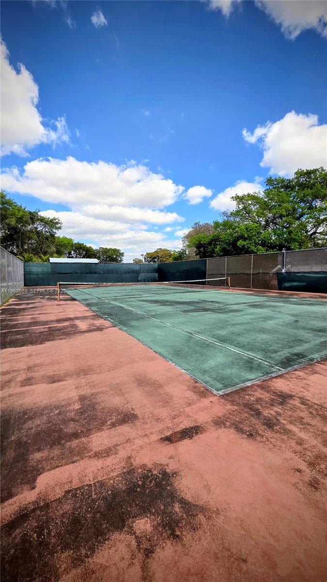 7925 Fairview Drive, Unit 206 Tamarac, FL 33321 - Photo 20 of 21 a view of a golf course with a lake