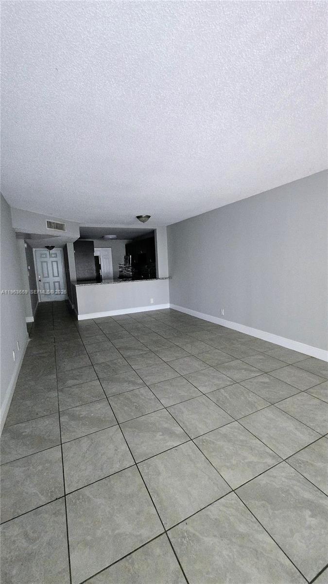 7925 Fairview Drive, Unit 206 Tamarac, FL 33321 - Photo 6 of 21 a view of a livingroom with a lounge chair