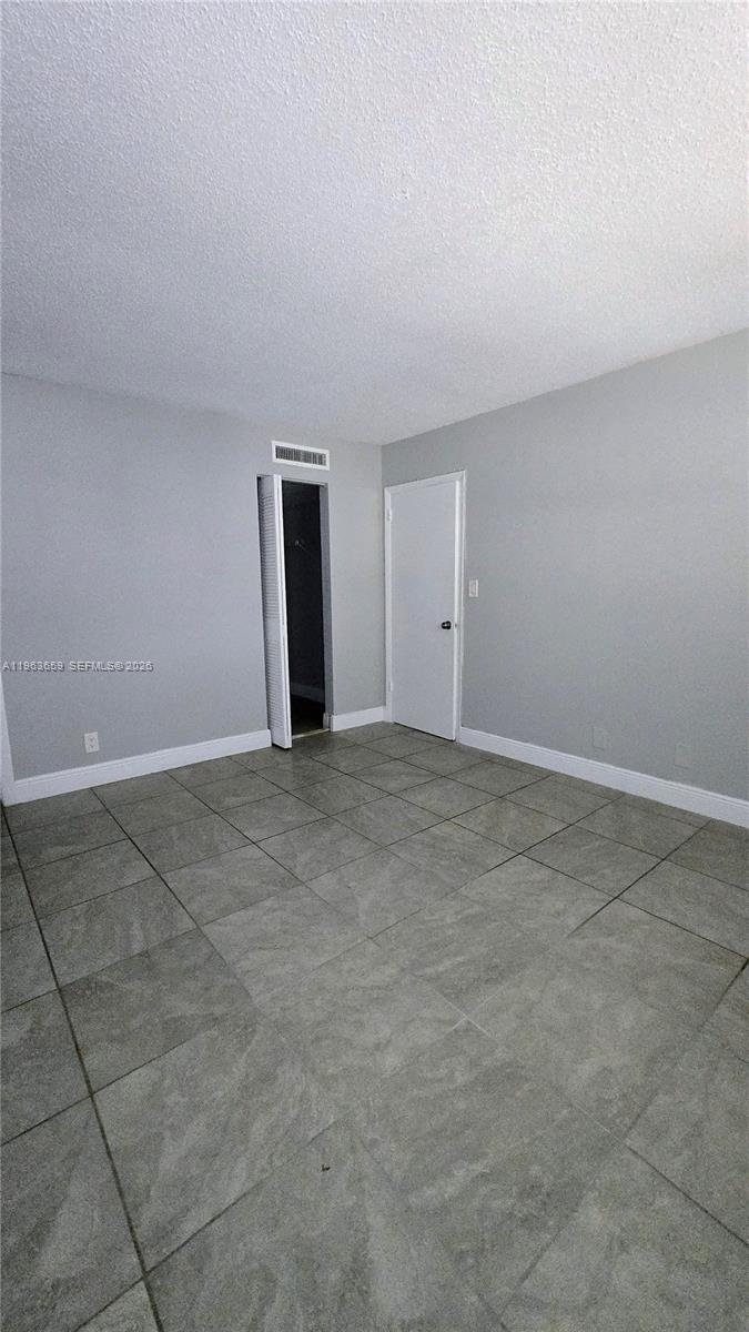 7925 Fairview Drive, Unit 206 Tamarac, FL 33321 - Photo 9 of 21 a view of an empty room and entryway