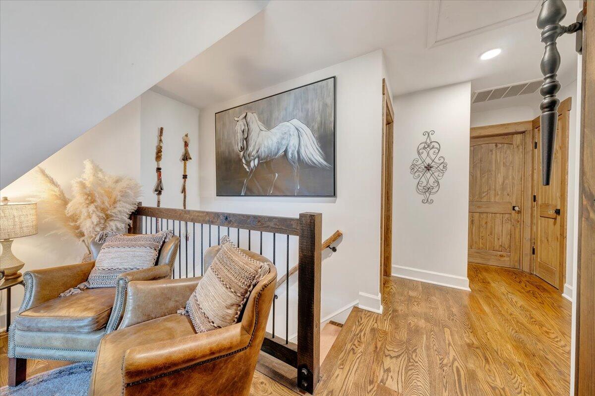 3851 Joppa Mill Road Moneta, VA 24121 - Photo 57 of 104 a view of a hallway with furniture and wooden floor
