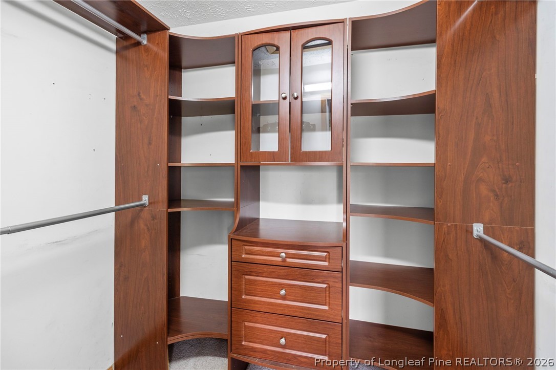 28 Coyt Circle Spring Lake, NC 28390 - Photo 24 of 41 a view of walk in closet with empty racks