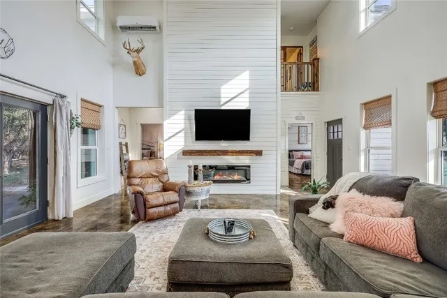 a living room with furniture and kitchen view