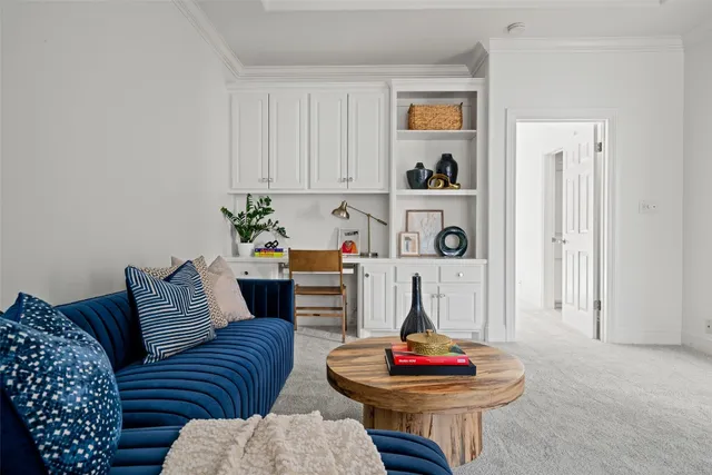 a living room with furniture and a painting