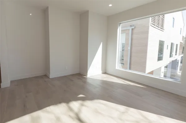 a view of a livingroom with wooden floor