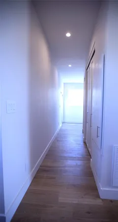 a view of a hallway with staircase