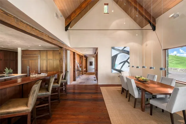 a view of house with backyard and outdoor seating