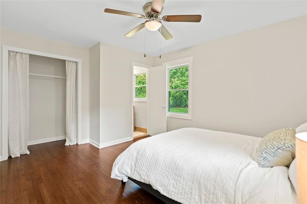 2483 Hunting Valley Drive Decatur, GA 30033 - Photo 11 of 24 a bedroom with a bed and a chandelier