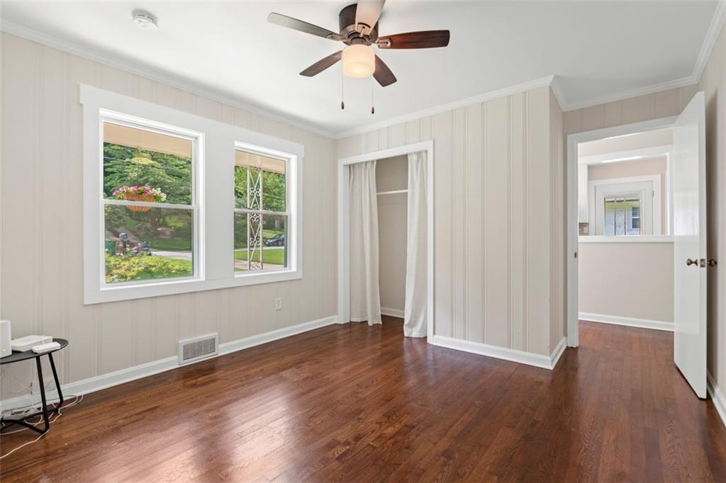 2483 Hunting Valley Drive Decatur, GA 30033 - Photo 14 of 24 a view of an empty room with wooden floor and a window