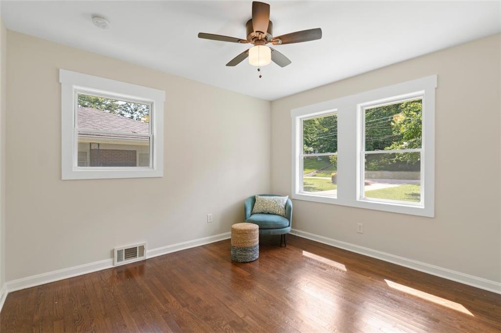 2483 Hunting Valley Drive Decatur, GA 30033 - Photo 17 of 24 a view of an empty room with a window and wooden floor