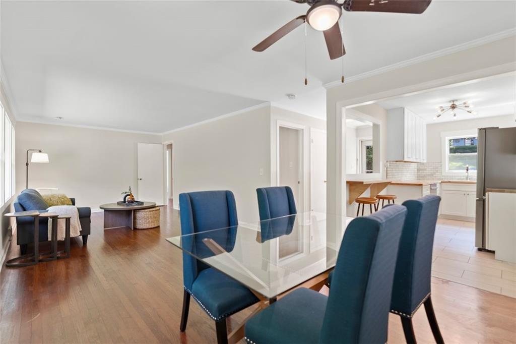 2483 Hunting Valley Drive Decatur, GA 30033 - Photo 7 of 24 a view of a dining room with furniture window and wooden floor