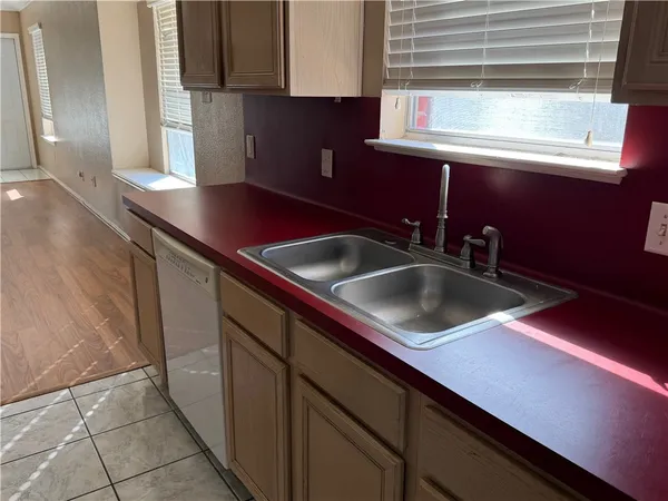 a kitchen with a sink and cabinets