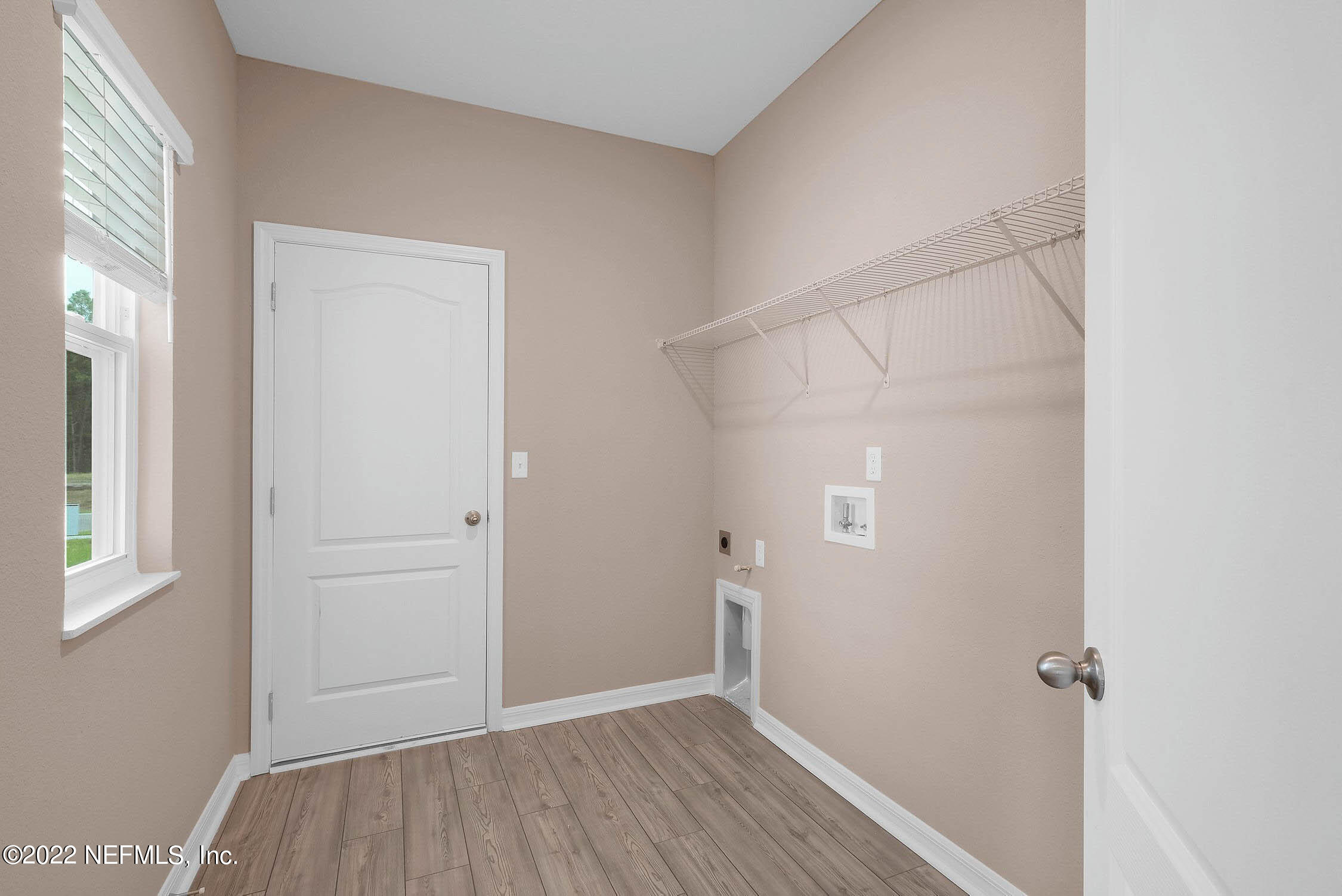 415 Falcon Ridge Road St. Augustine, FL 32084 - Photo 11 of 12 an empty room with wooden floor and closet