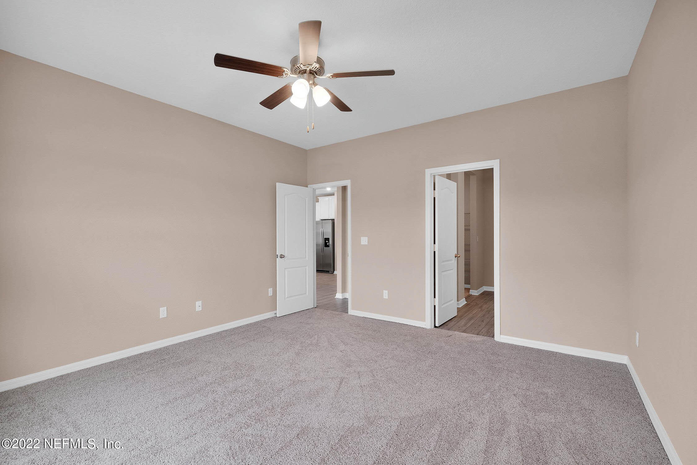 415 Falcon Ridge Road St. Augustine, FL 32084 - Photo 7 of 12 an empty room with chandelier fan