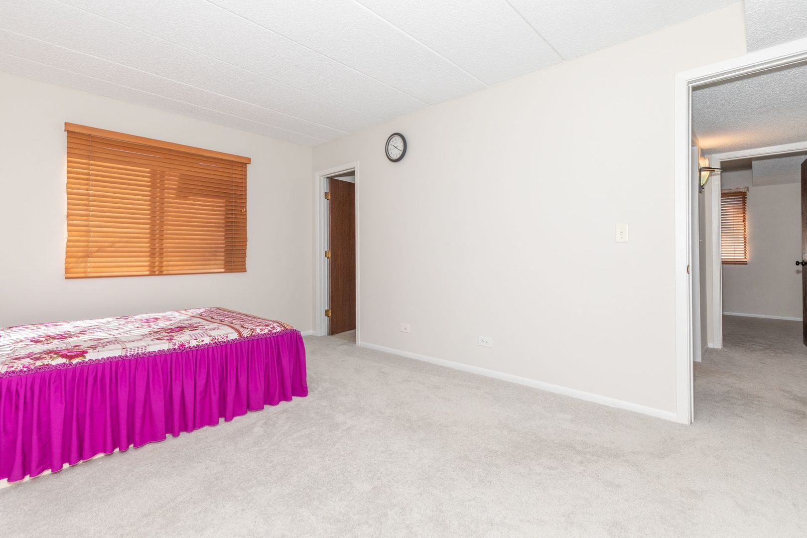 486 Timber Ridge Drive, Unit 102 Carol Stream, IL 60188 - Photo 14 of 23 a bedroom with a bed and a window