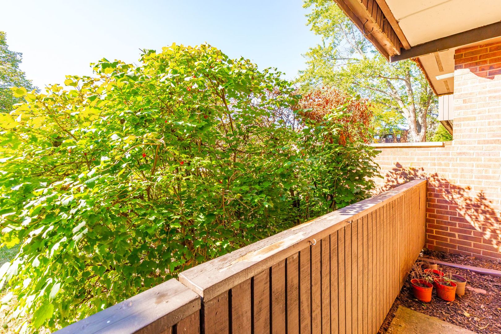 486 Timber Ridge Drive, Unit 102 Carol Stream, IL 60188 - Photo 18 of 23 a view of a wooden fence and floor