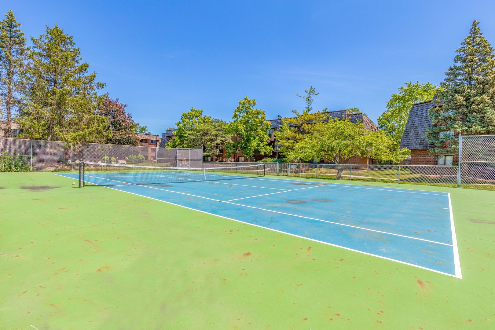 486 Timber Ridge Drive, Unit 102 Carol Stream, IL 60188 - Photo 20 of 23 a view of a tennis court