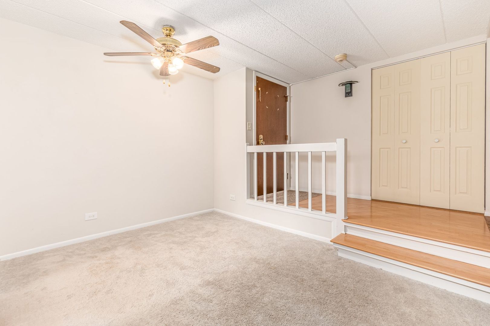 486 Timber Ridge Drive, Unit 102 Carol Stream, IL 60188 - Photo 5 of 23 a view of an empty room with a window