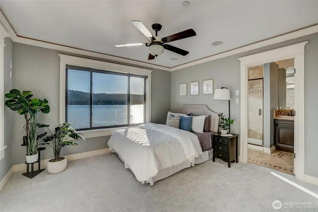 a bed room with a bed and a potted plant