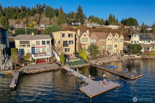 a view of a lake with a house swimming pool and outdoor space