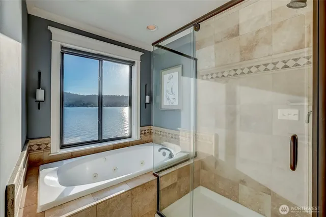 a bathroom with a tub and a shower