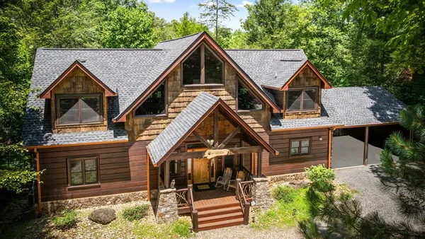 an aerial view of a house with a garden