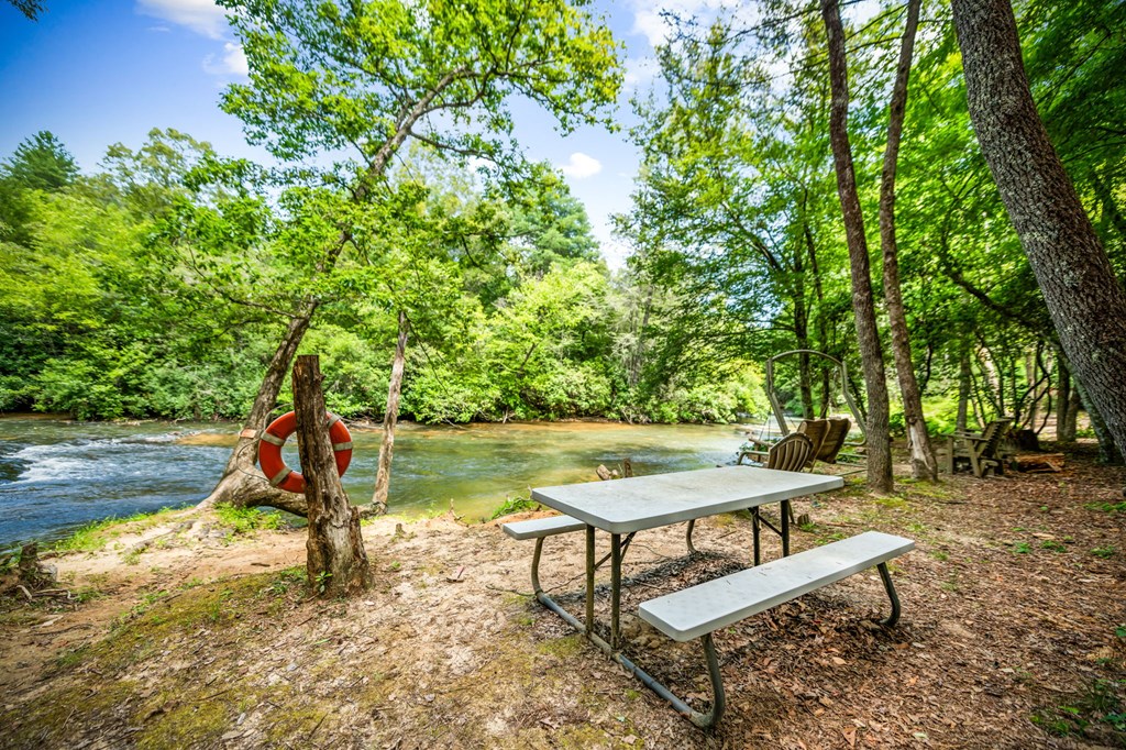 1082 Sunset Road Epworth, GA 30541 - Photo 16 of 69 a view of a park with a bench and plants