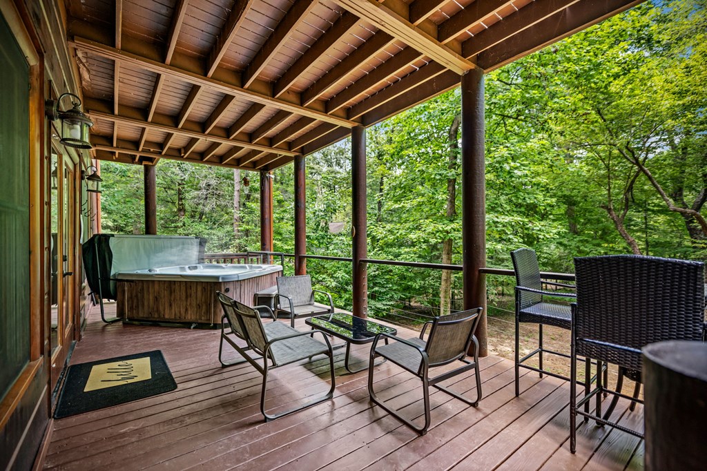 1082 Sunset Road Epworth, GA 30541 - Photo 20 of 69 a view of a patio with table and chairs and wooden floor