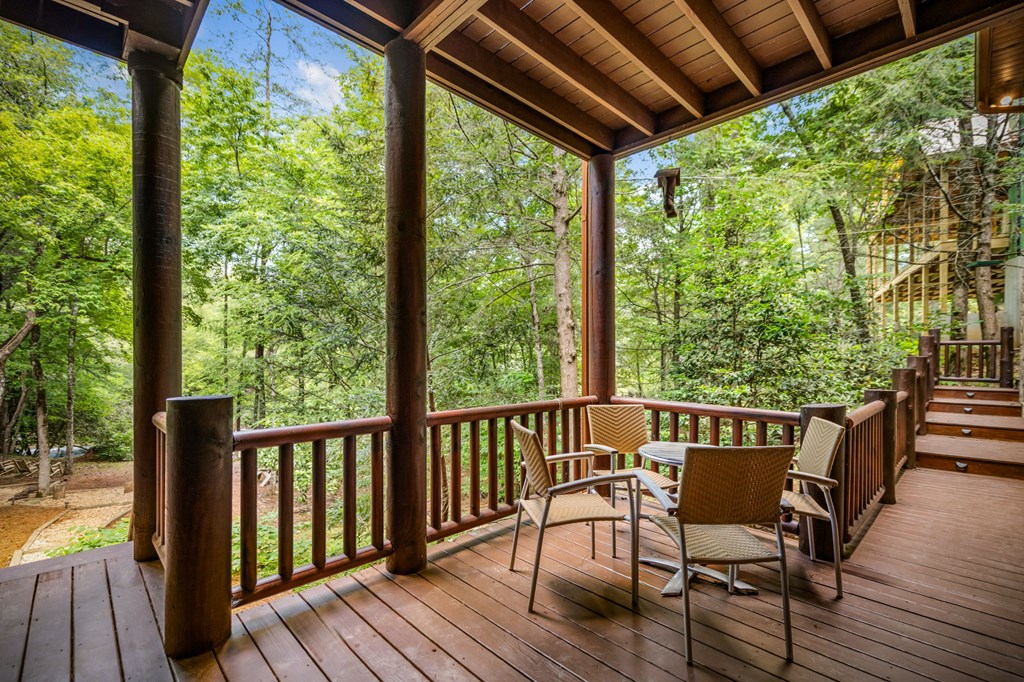 1082 Sunset Road Epworth, GA 30541 - Photo 24 of 69 a view of a wooden chairs on the roof deck