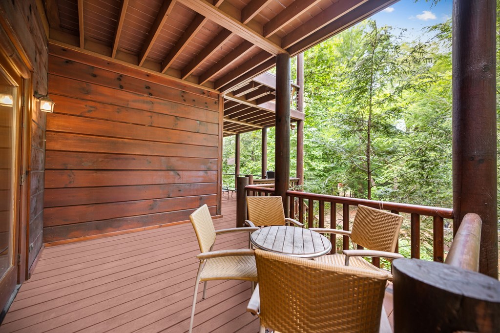 1082 Sunset Road Epworth, GA 30541 - Photo 25 of 69 a view of a chair in wooden deck