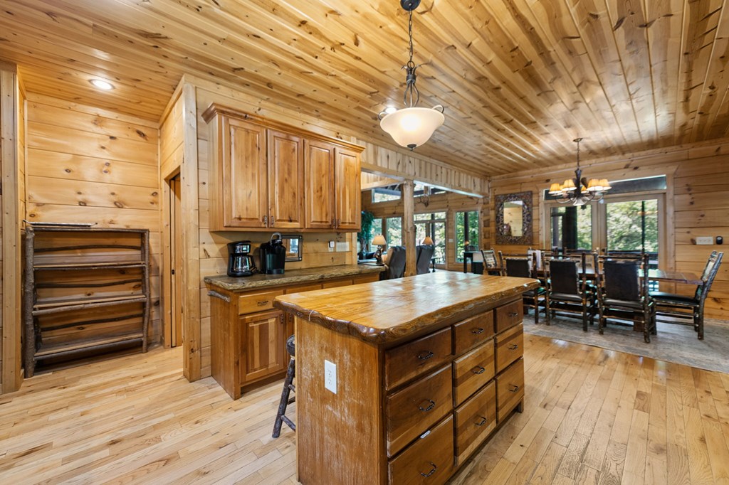 1082 Sunset Road Epworth, GA 30541 - Photo 46 of 69 a kitchen with stainless steel appliances granite countertop a stove and a wooden floors
