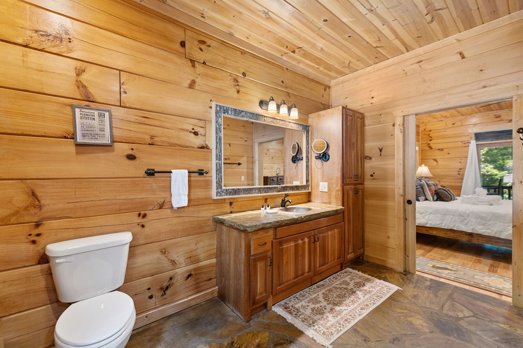 1082 Sunset Road Epworth, GA 30541 - Photo 54 of 69 a bathroom with a sink a toilet and shower