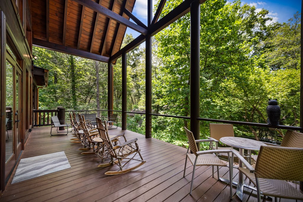 1082 Sunset Road Epworth, GA 30541 - Photo 59 of 69 a view of a chairs and table in patio with a yard