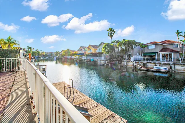 a view of a lake with a table and chairs