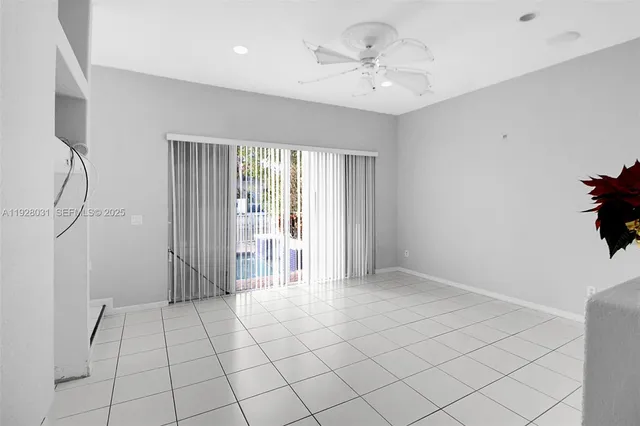 a view of an empty room and window