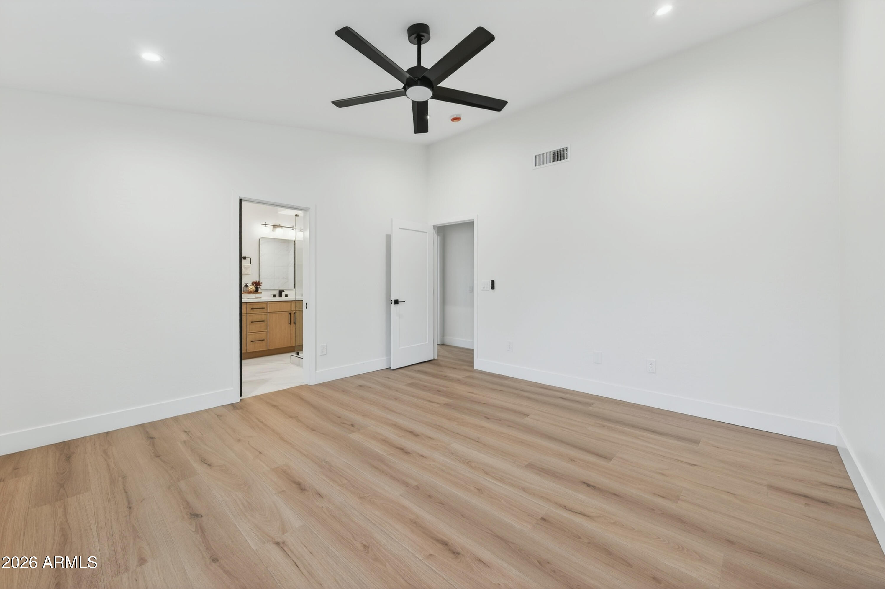 2432 West St Moritz Lane Phoenix, AZ 85023 - Photo 26 of 41 Primary Bedroom with Bath Entry