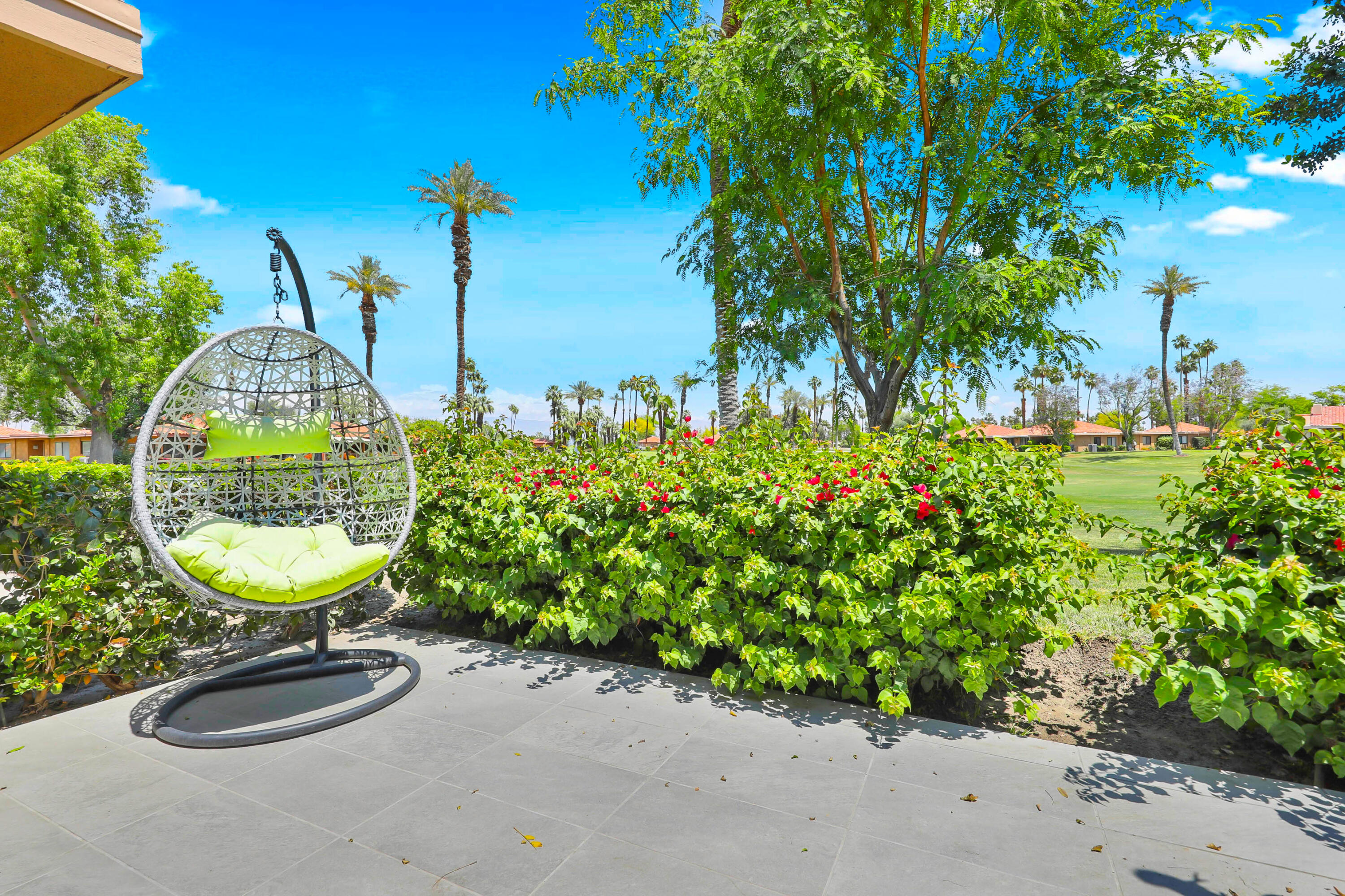 23 Haig Drive Rancho Mirage, CA 92270 - Photo 21 of 49 a view of a swimming pool with a chairs and plants