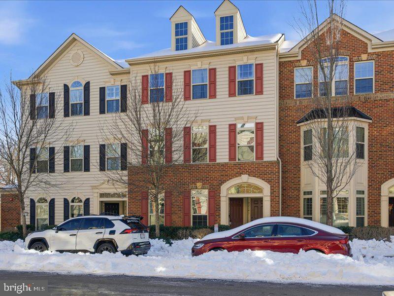 42143 Piebald Square Aldie, VA 20105 - Photo 1 of 34 a front view of a residential apartment building with parking space