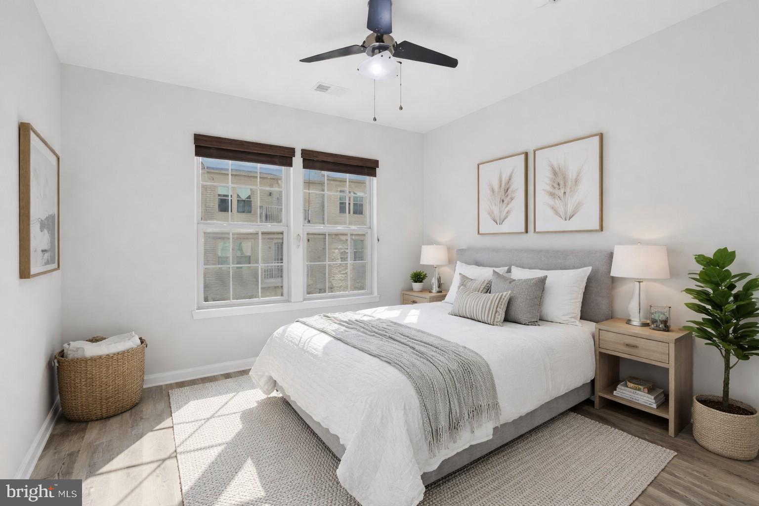 42143 Piebald Square Aldie, VA 20105 - Photo 15 of 34 a bedroom with a bed and a potted plant