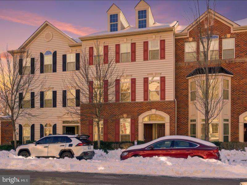 42143 Piebald Square Aldie, VA 20105 - Photo 2 of 34 a front view of a residential apartment building with parking space