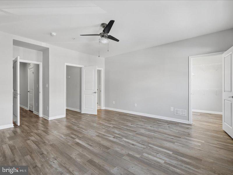 42143 Piebald Square Aldie, VA 20105 - Photo 21 of 34 a view of an empty room and wooden floor