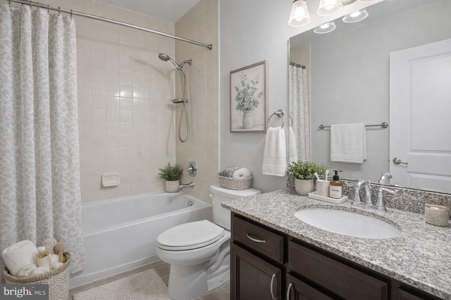 42143 Piebald Square Aldie, VA 20105 - Photo 23 of 34 a bathroom with a granite countertop sink toilet and shower