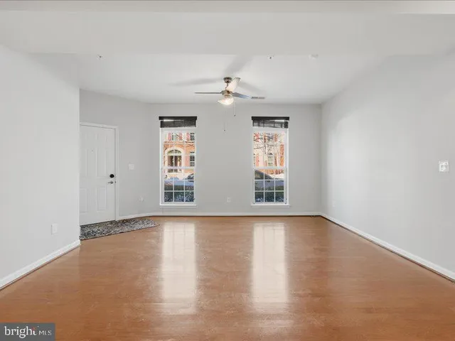 a kitchen with stainless steel appliances granite countertop a stove a refrigerator and a sink