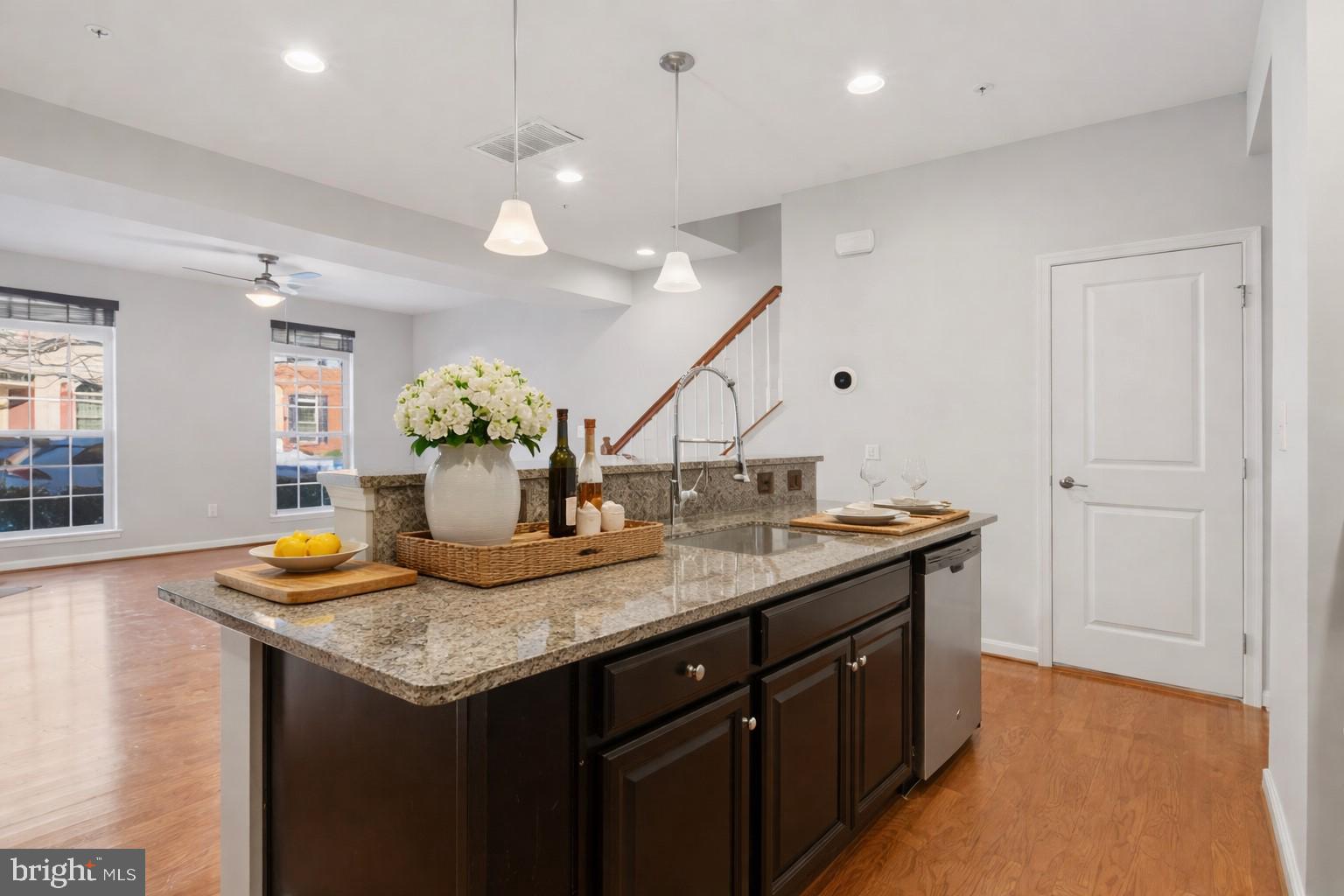 42143 Piebald Square Aldie, VA 20105 - Photo 10 of 34 a kitchen with center island and chandelier