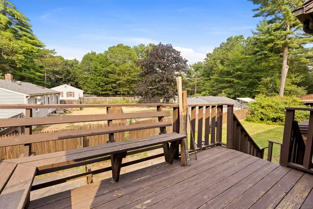 a view of a wooden deck with a bench