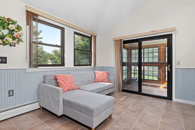 a living room with furniture and a window