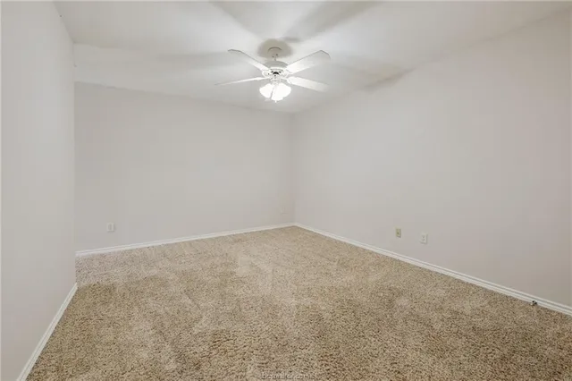 a view of a room with a fan